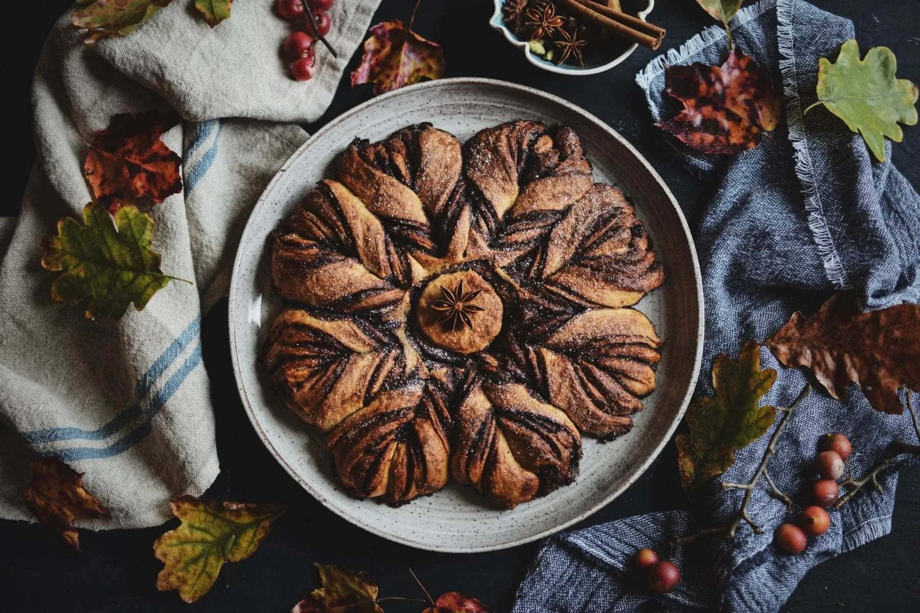 Sourdough chai spice star bread on a serving platter on a table